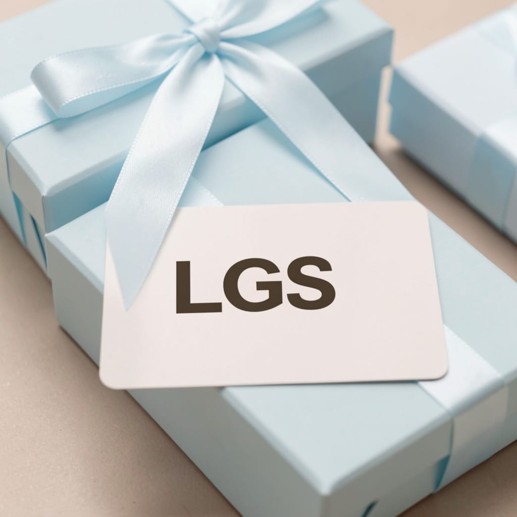 Make a difference in someone's life - A priceless gift LGS Solutions blue gift box carefully wrapped on a golden cloth.